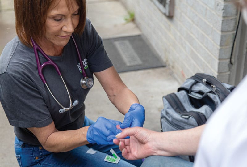 woman taking blood sugar