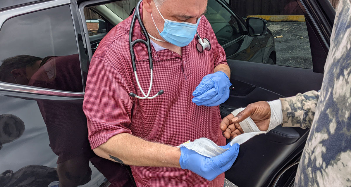 man giving medical services